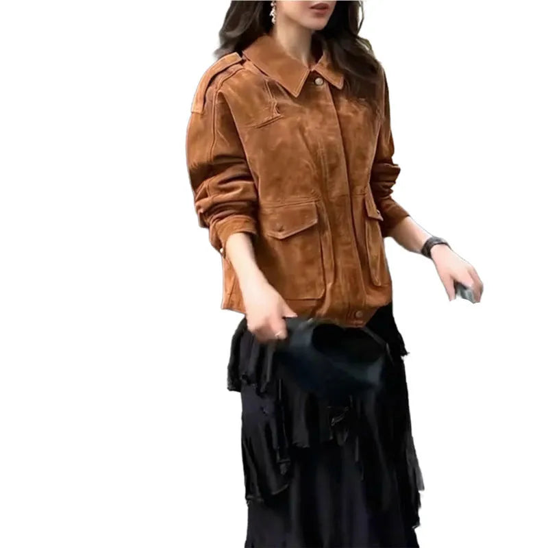 Women's bright brown suede coat with regular sleeves on a hanger