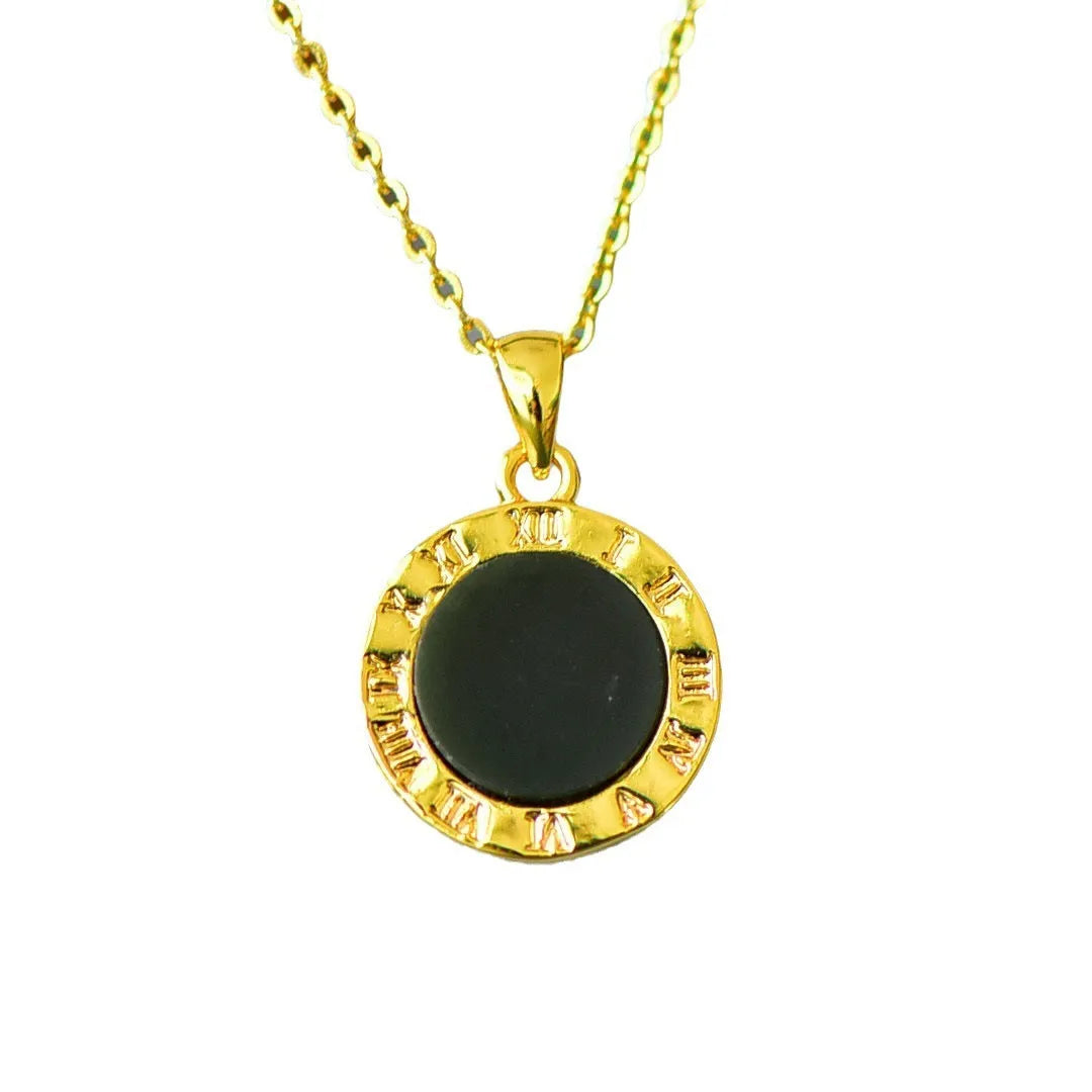 Flat grey Hetian jade pendant with copper metal inlay and small ink blue jade accents on a necklace chain.