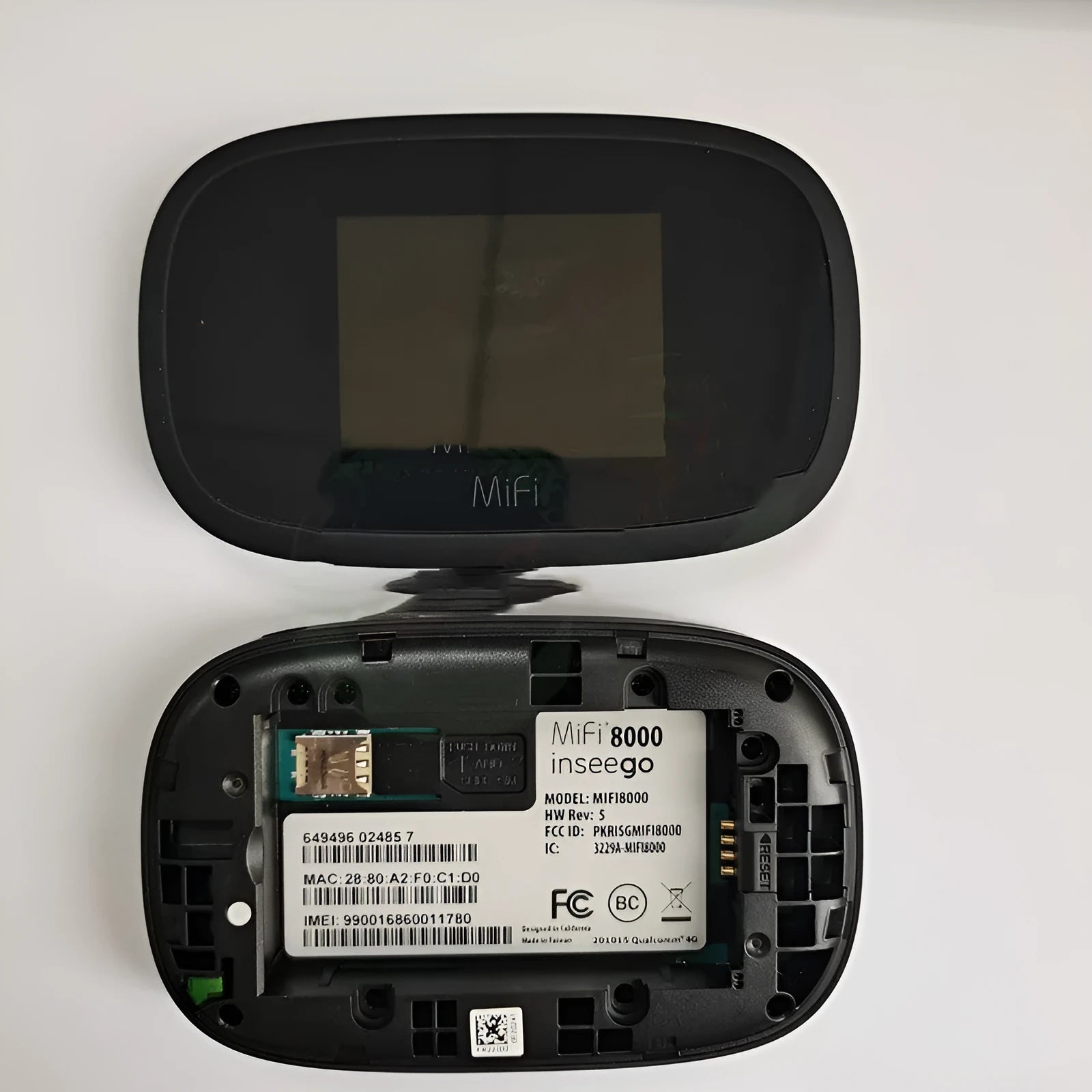 Black MiFi8000 portable 4G wireless router with battery and cable.
