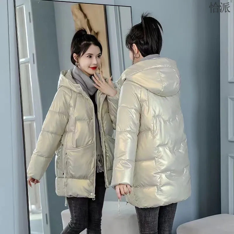 A woman's loose-fitting, thick, hooded winter jacket in a choice of colours on a size chart background.