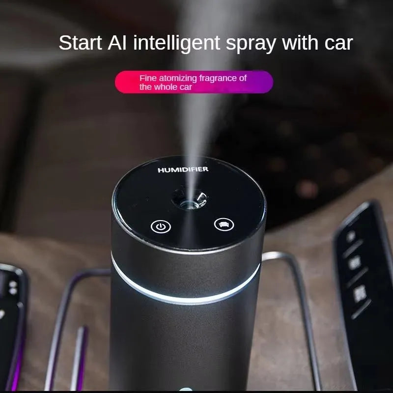 Black aluminium portable car air humidifier and essential oil diffuser unit with USB cable.