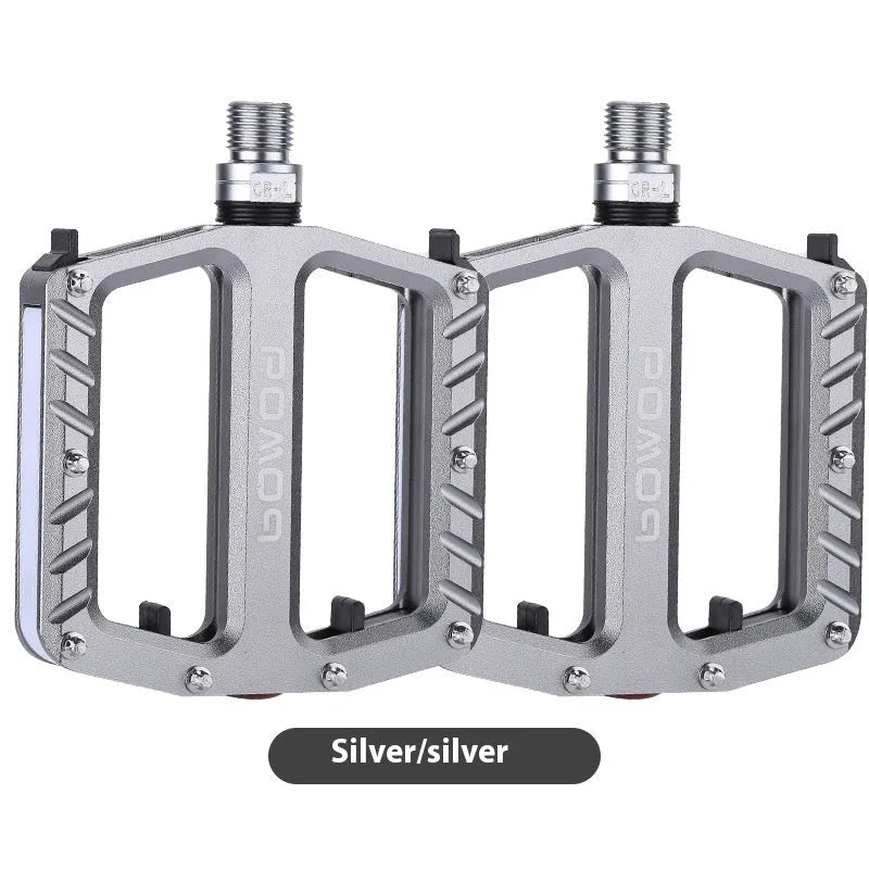 Pair of aluminium alloy bicycle pedals with integrated LED lights in a choice of colours.