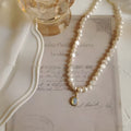 French Court vintage-style alloy necklace with a geometric charm on an adjustable chain.