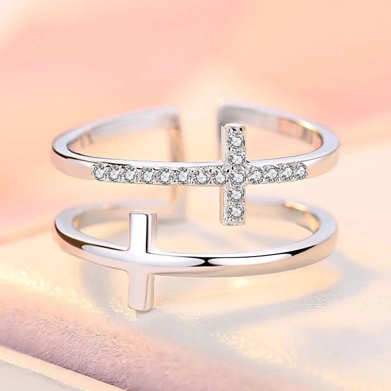 Women's adjustable copper ring with a double cross design and sparkling zircon inlays.