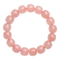 Natural pink crystal barrel bead bracelet with geometric 8x10mm beads