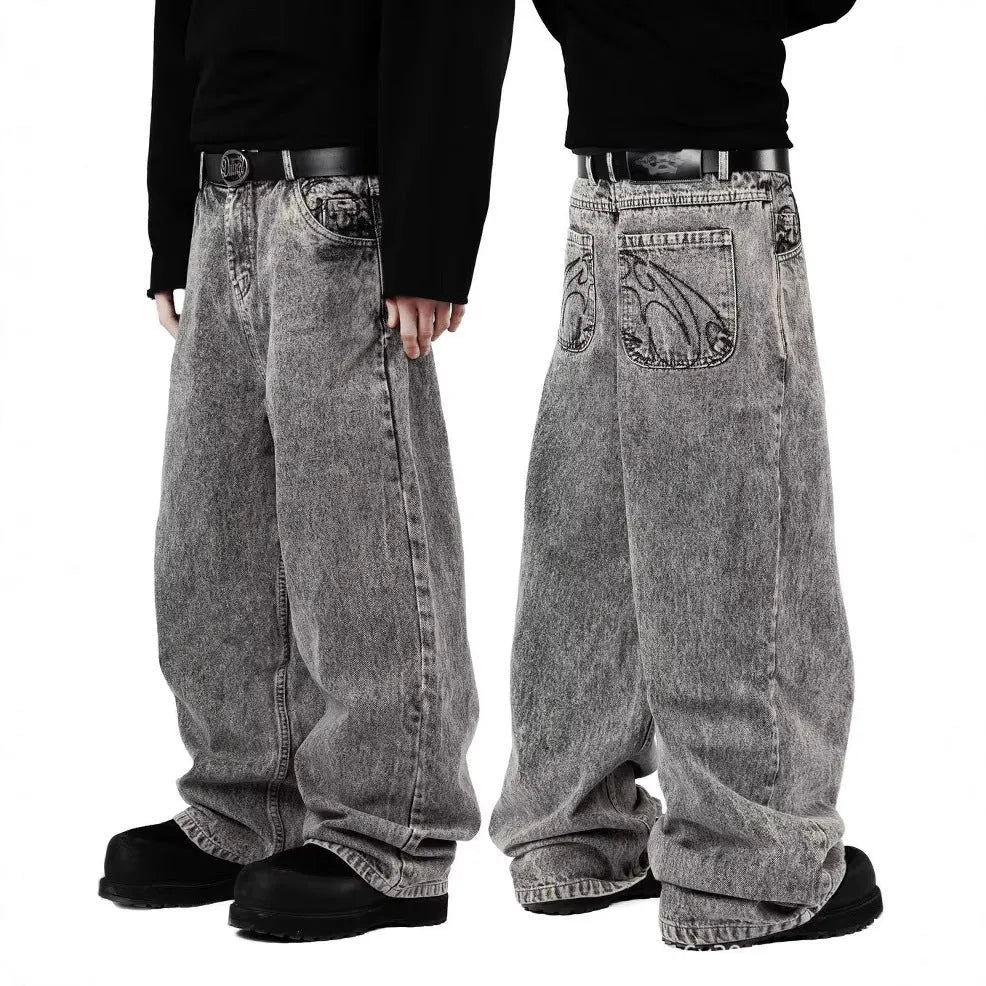 Grey loose straight-leg denim trousers for men and women on a hanger