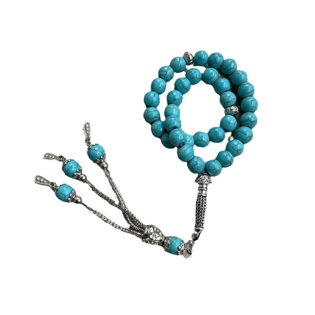 Sky blue stone Muslim dhikr bracelet with 8mm handmade beads on a wrist.