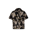 Man wearing a black ice silk shirt with floral print, Cuban collar, and short sleeves.