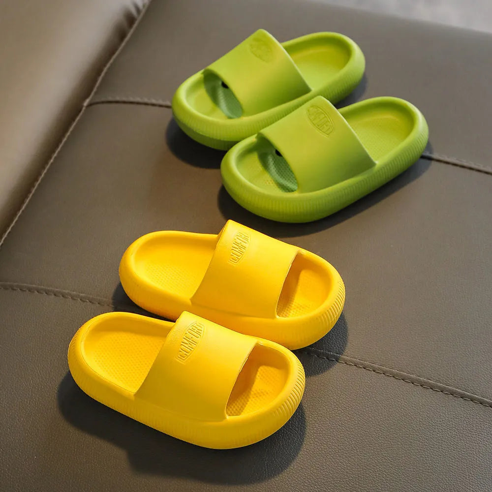 Colourful children's EVA slippers with a thick, textured non-slip sole in various sizes.