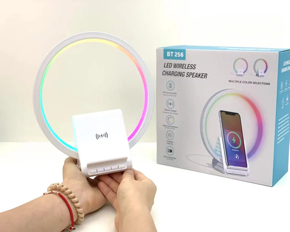 White circular Bluetooth speaker with wireless charging surface measuring 225mm diameter