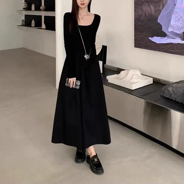 Women's black knitted dress with square collar, long sleeves, elastic waist, and A-line skirt.