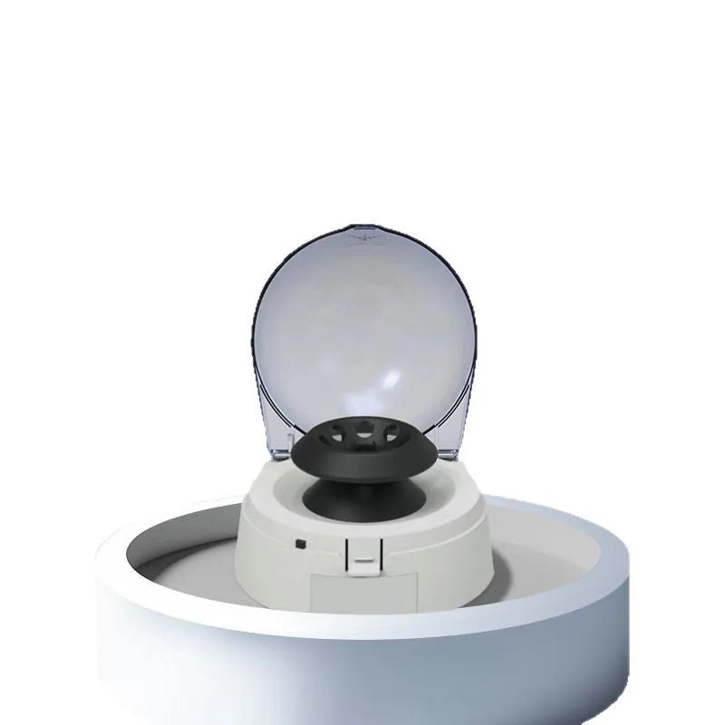 Small white mini centrifuge laboratory body with 7000 RPM specification and compact dimensions on a lab bench