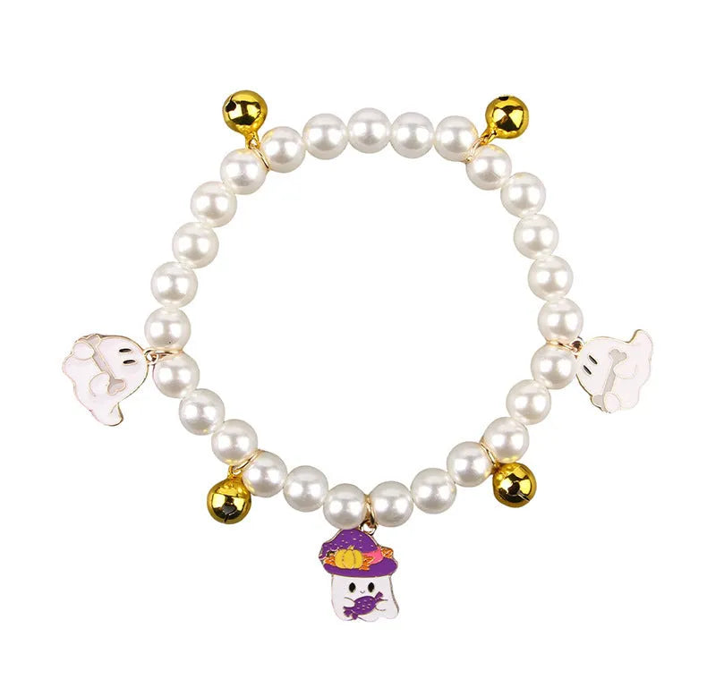 Halloween-themed cat collar with simulated pearl necklace decoration showing pumpkin designs