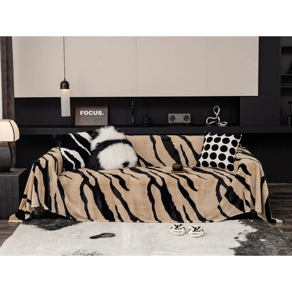 Zebra pattern flannel sofa slipcover in caramel colour, shown on a grey sofa