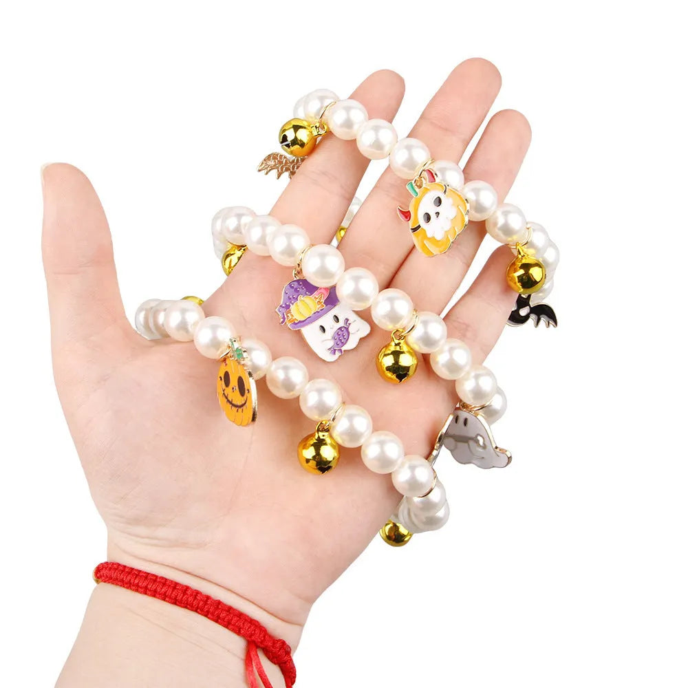 Halloween-themed cat collar with simulated pearl necklace decoration showing pumpkin designs