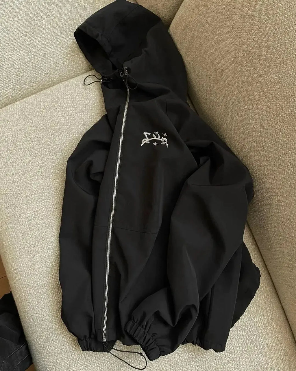 Men's grey hooded sunscreen jacket showing loose British style fit and polyester fabric construction