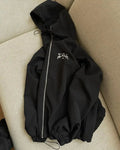 Men's grey hooded sunscreen jacket showing loose British style fit and polyester fabric construction