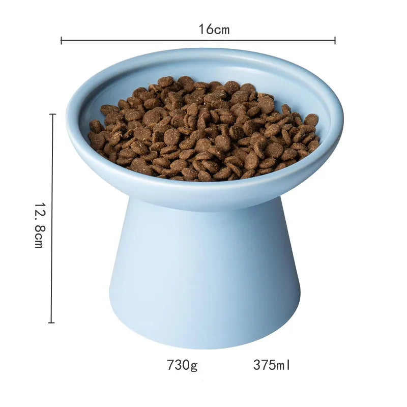 Wide shallow blue elevated ceramic bowl for cat food and water on a floor