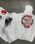 Black loose hooded sweatshirt with white printed skull and rhinestone design, showing cardigan style and long sleeves.