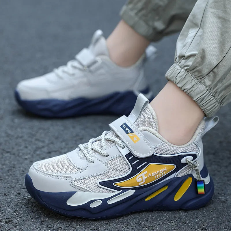 Boys' blue and black Velcro fastening sports shoes with a textured non-slip sole.