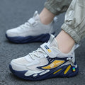 Boys' blue and black Velcro fastening sports shoes with a textured non-slip sole.