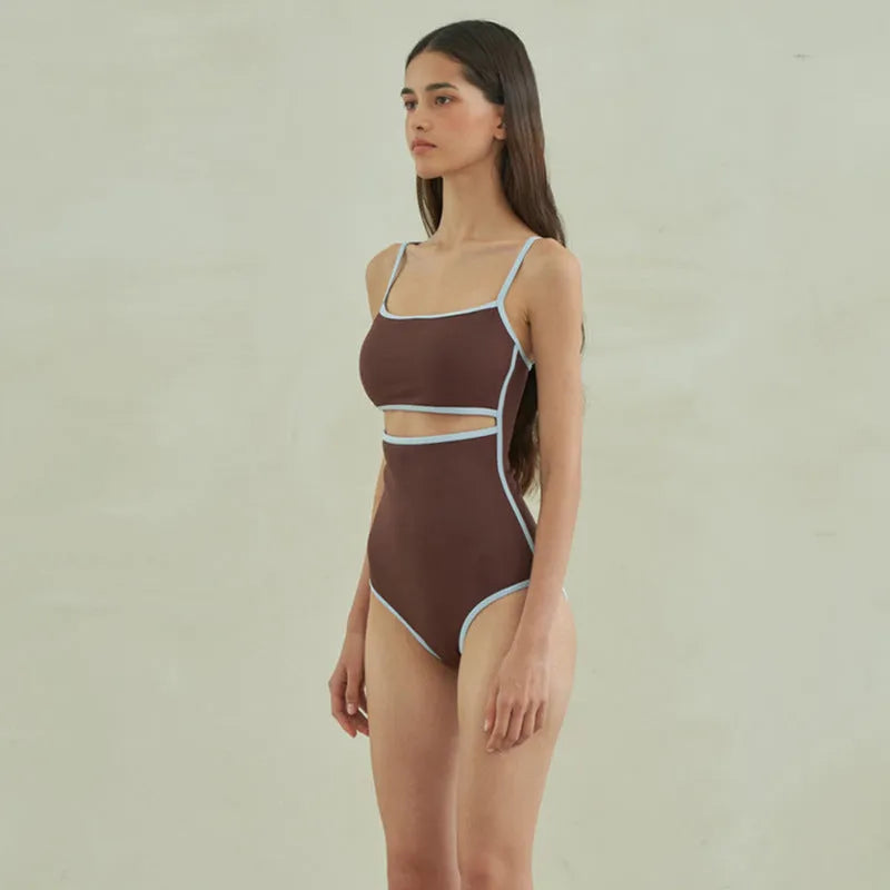 Brown women's one-piece swimsuit with triangle top design and sexy pattern