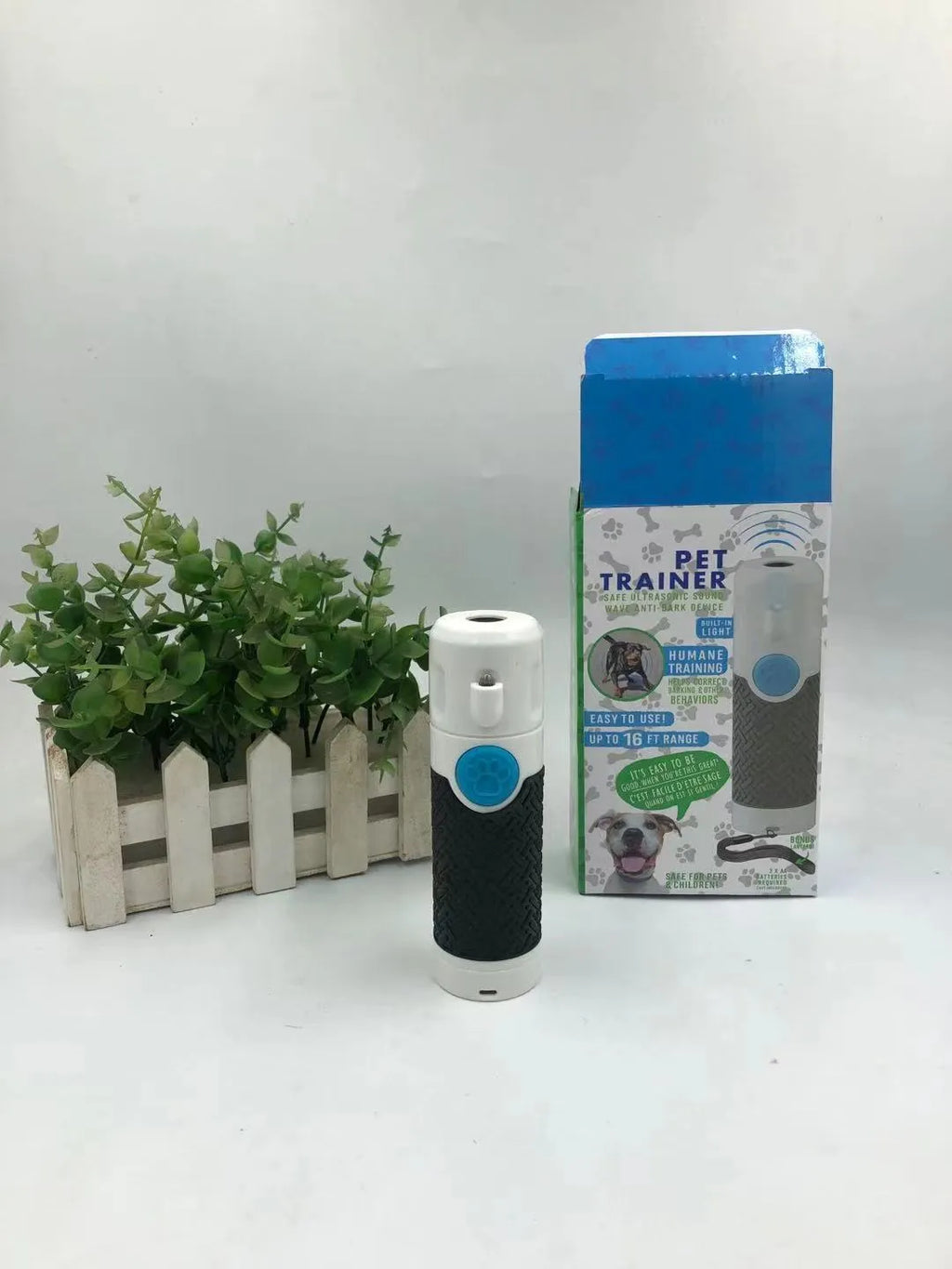 White handheld ultrasonic dog bark control trainer with ABS plastic casing
