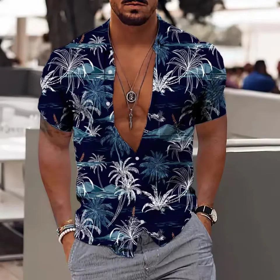 Man wearing a loose-fitting, short-sleeve floral print shirt in a cardigan style against a summer background.