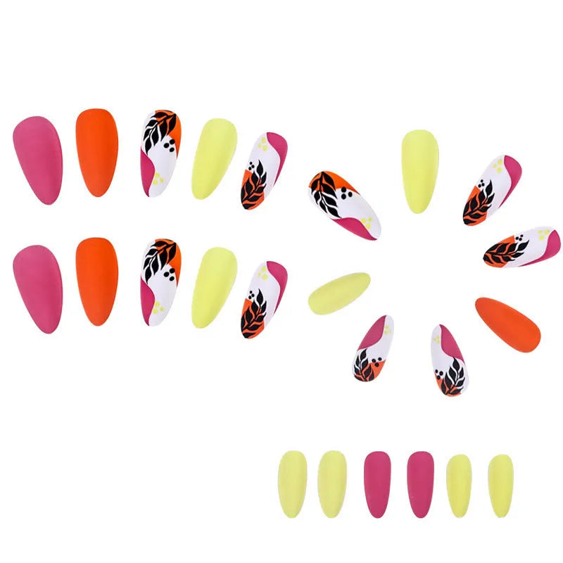 Four boxes of almond-shaped frosted nail stickers showing French leaves, leopard print, macaron and plating designs
