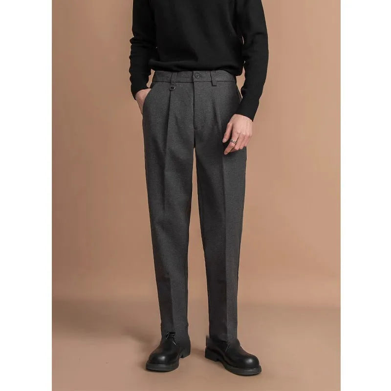 Men's straight-leg suit trousers in black, brown, grey, or khaki, shown on a model.