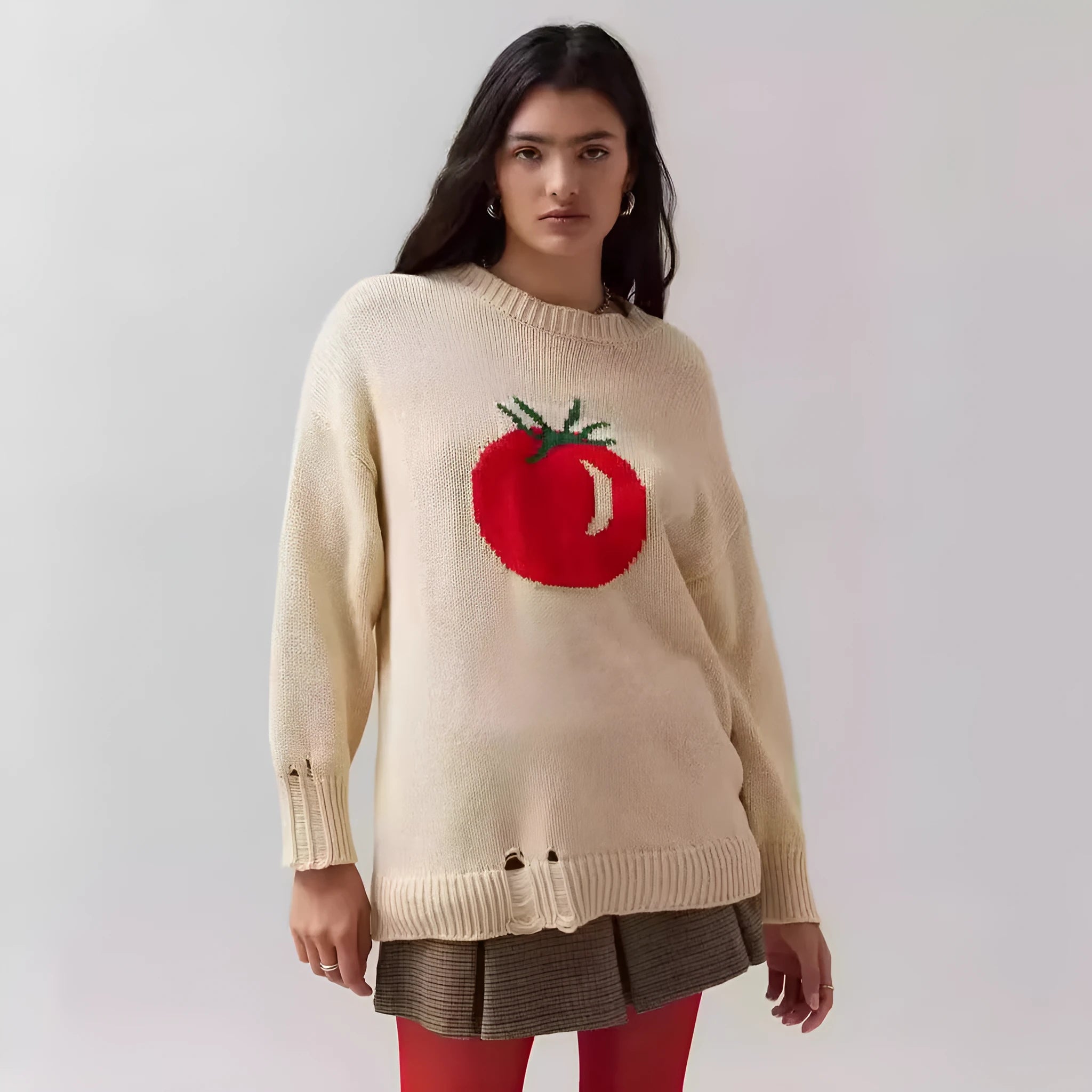 Women's milky white acrylic round neck sweater with jacquard long sleeves, laid flat.