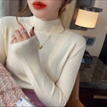 Women's slim fit long sleeve knitted pullover top in viscose fibre, shown in apricot colour.
