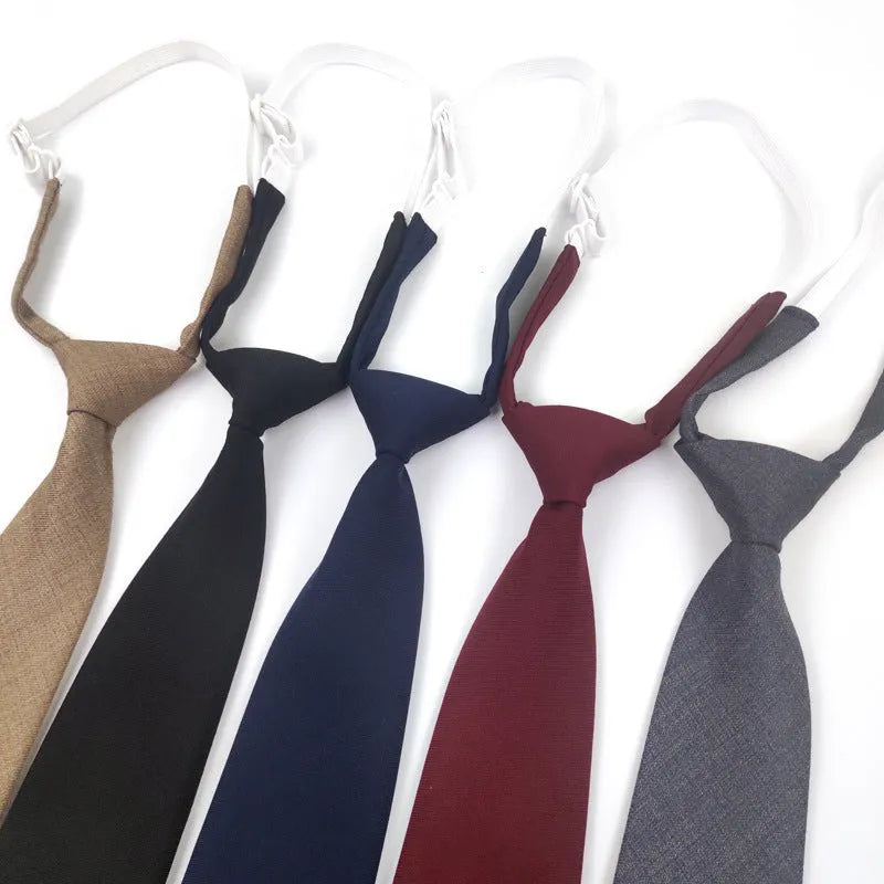 Solid navy blue cotton men's tie with arrow style on a white background.