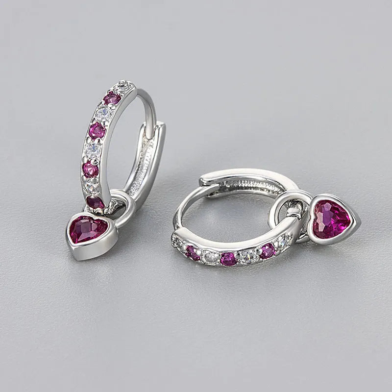 Women's fashion earrings with heart-shaped zircon eardrops in gold and white gold coloured settings
