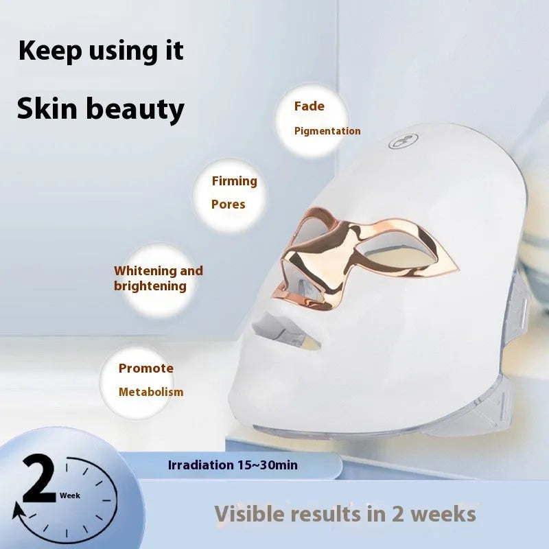 Rechargeable LED beauty mask with touch controls in white and gold colour.