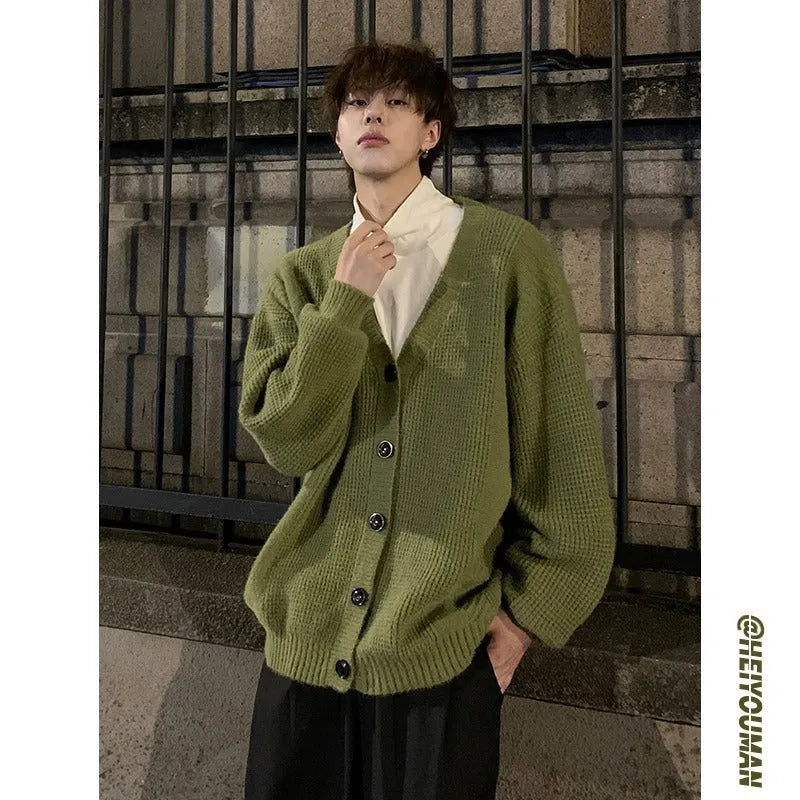 Men's V-neck cardigan sweater in army green colour showing loose fit and casual styling