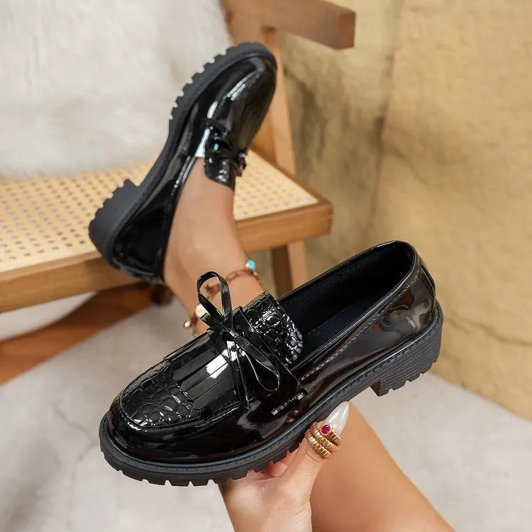 Women's black and brown bow loafers with artificial PU upper, shown in EU sizes 36-43.