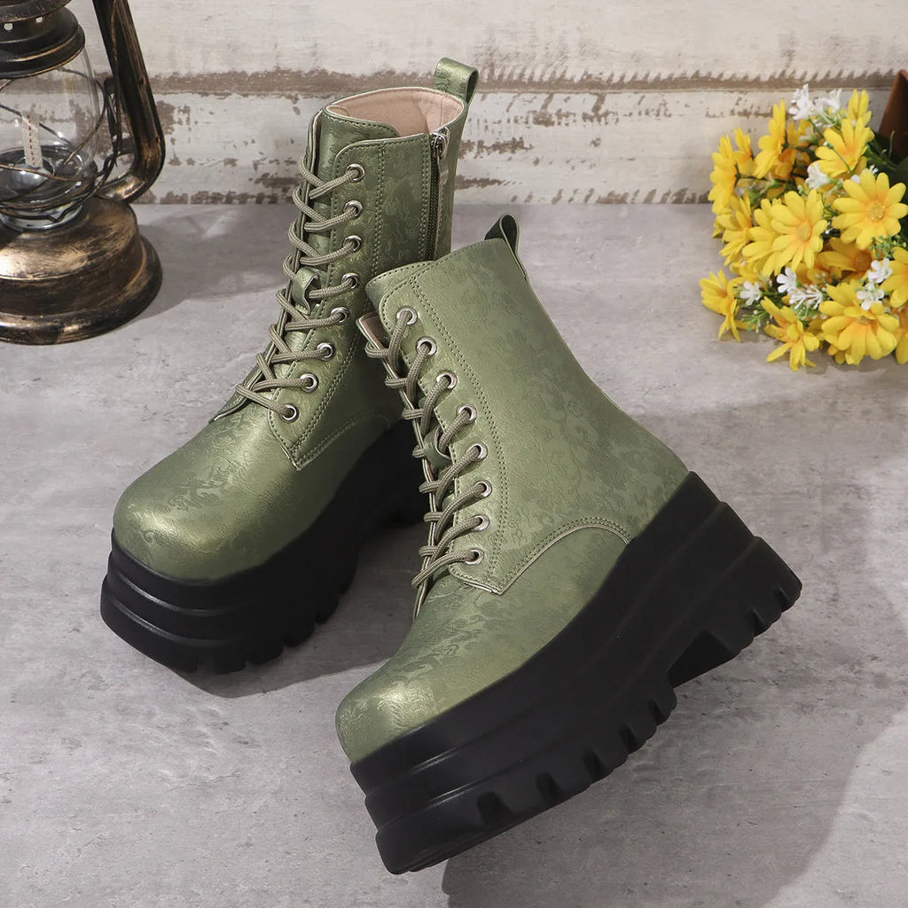 Women's white retro platform boots with patchwork PU upper and chunky rubber sole.