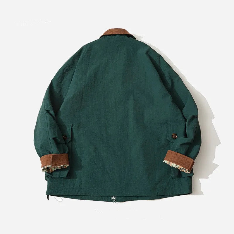 Green and apricot unisex casual jacket with contrast colour blocks and side seam pockets.