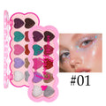 Heart-shaped makeup palette open to show ten pearlescent eyeshadow pans in various colours.
