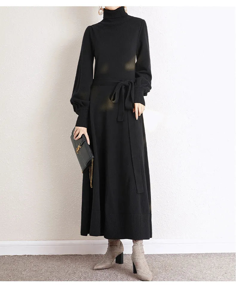 Rose red turtleneck knit dress with long sleeves, elastic waist, and a loose flowing mid-length skirt.