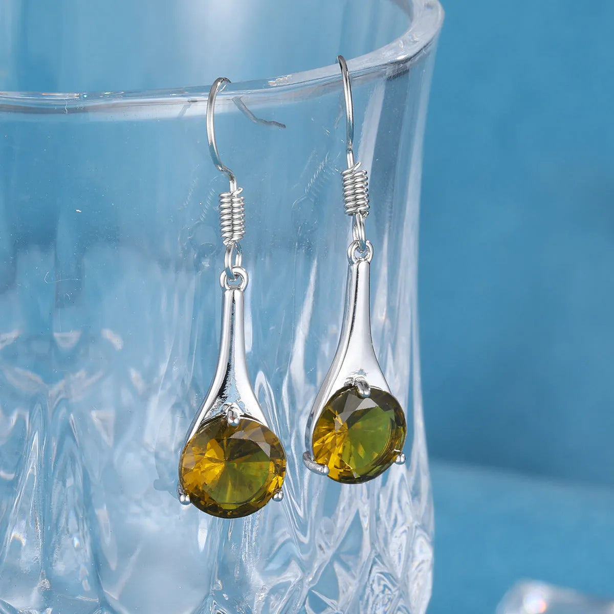 Olive green topaz colour drop earrings with water drop shape and electroplated finish