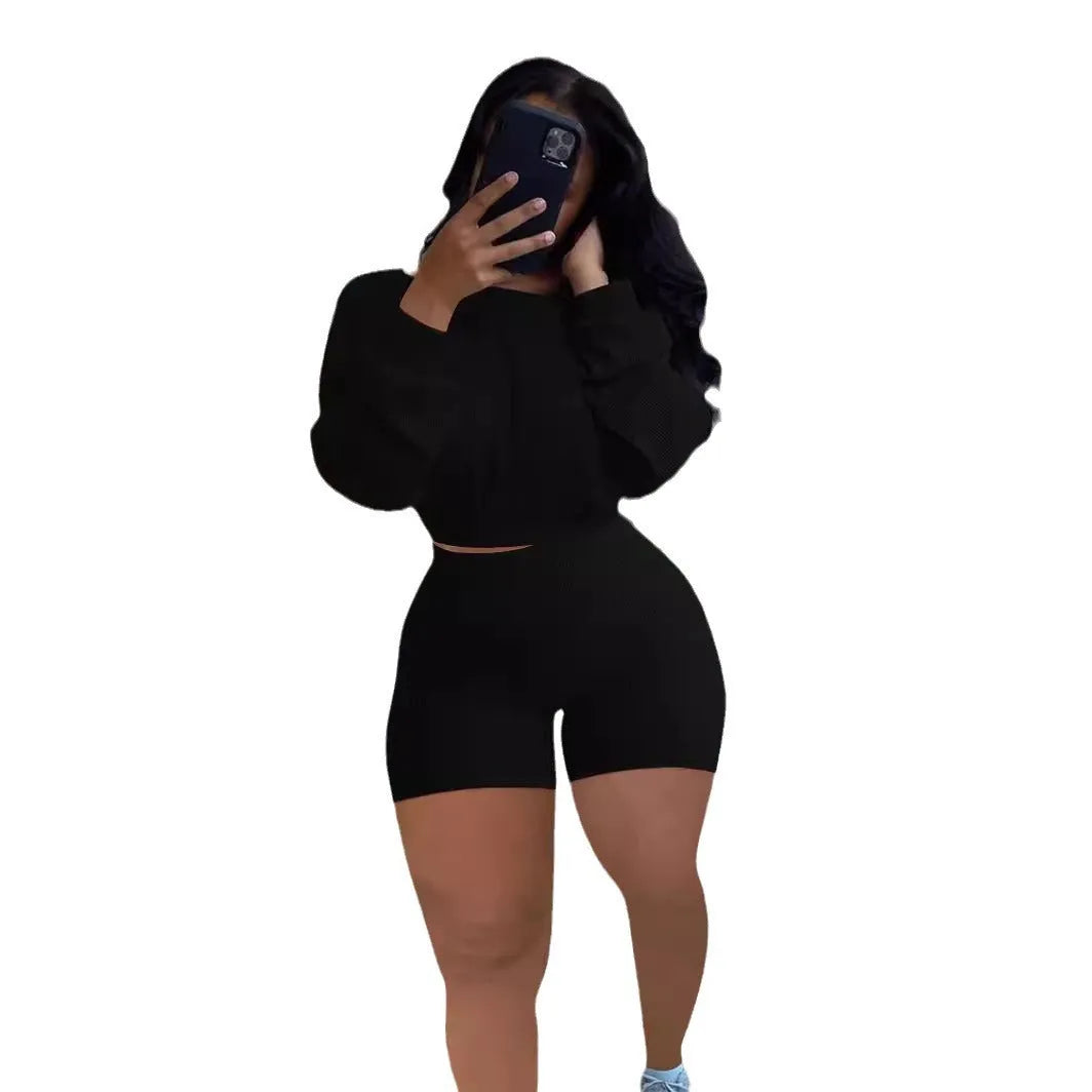 Women's sunken stripe off-the-shoulder long sleeve top and shorts two-piece set in a solid colour.