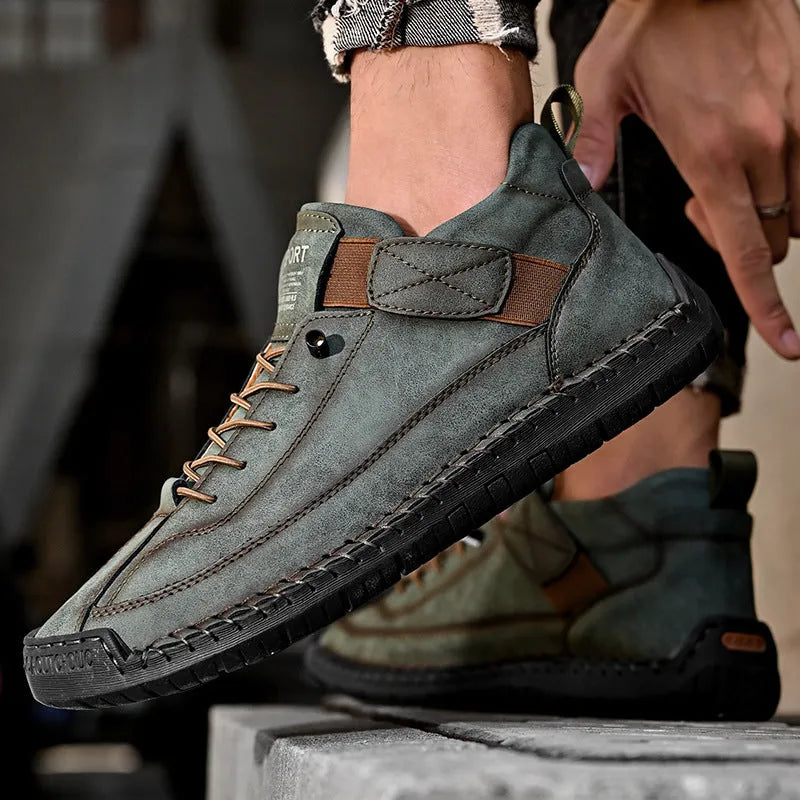 Men's mid-top Martin boot in khaki with tooling stitching and elastic band fastening.