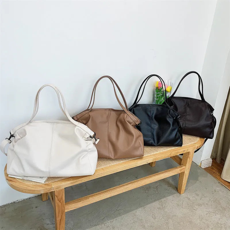 Large soft black PU leather messenger bag with adjustable shoulder strap and front zip.