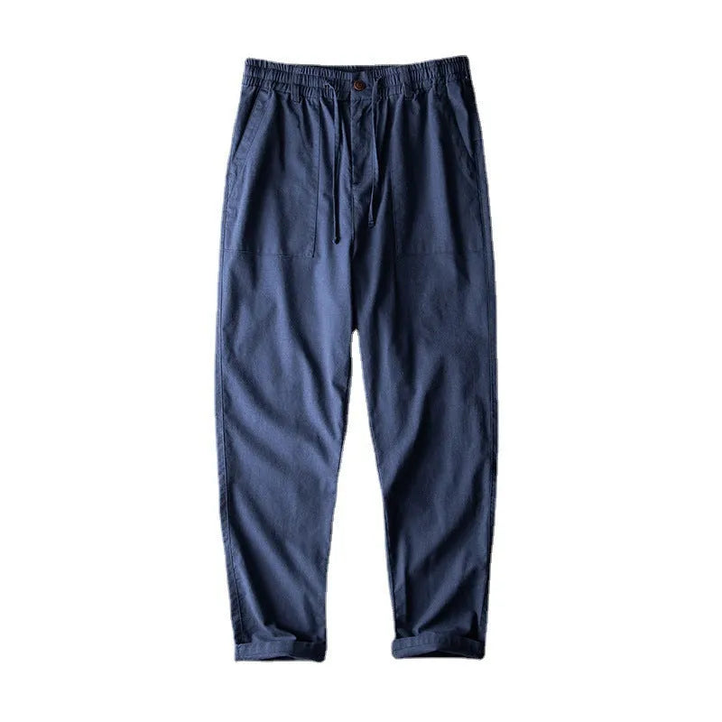 Men's linen casual trousers in solid colours showing mid waist design and trousers length