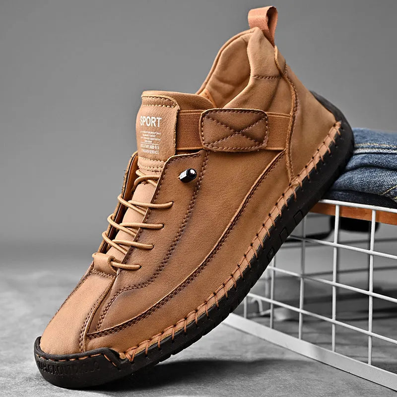 Men's mid-top Martin boot in khaki with tooling stitching and elastic band fastening.