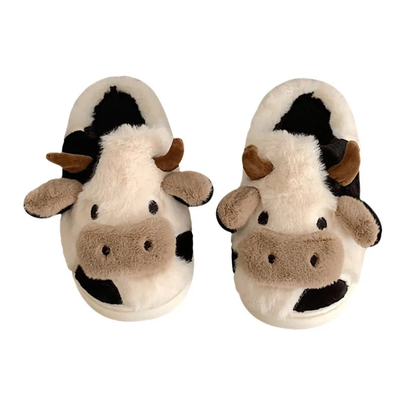 White women's cow slippers with plush faux fur upper and textured non-slip soles
