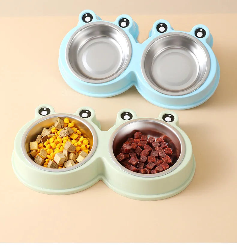 Blue stainless steel double bowl pet feeder with frog-shaped centrepiece for cat or dog food and water.