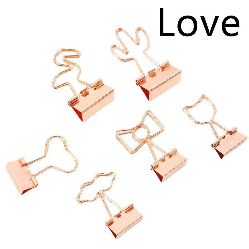 Gold metal decorative paper clip showing flamingo, love, cloud, cat, cactus, and bow shape options.